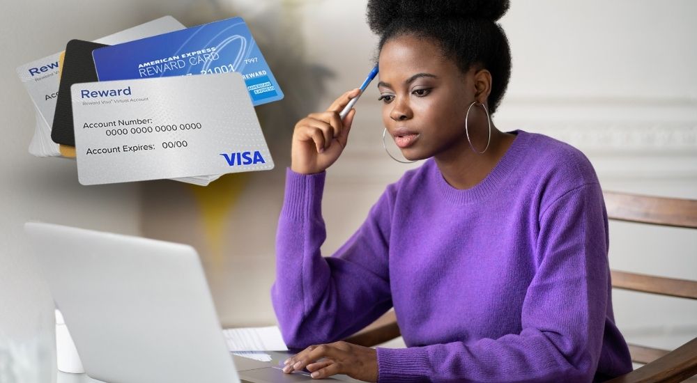woman looking at computer, reward cards